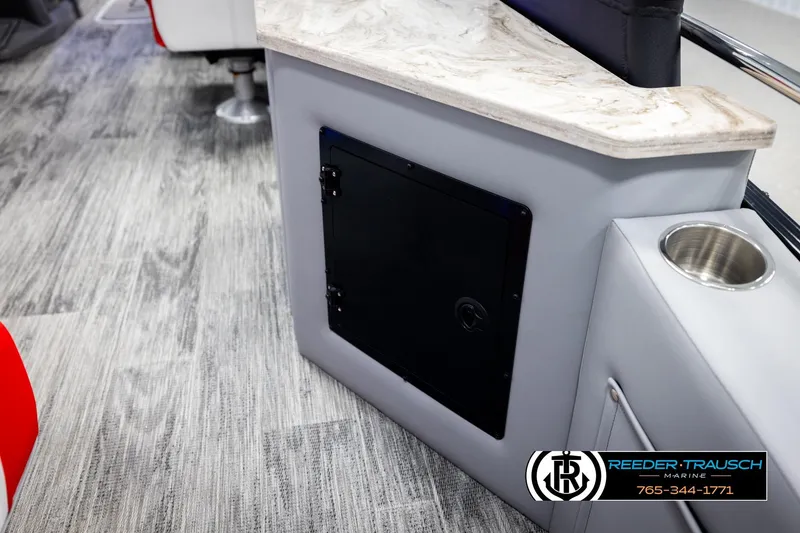 Slide: The Image of Interior of 2026 Avalon CAT CRBW boat with modern design and cup holder. - 30