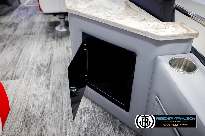 Slide: The Image of 2026 Avalon CAT CRBW interior with open storage compartment and cup holder. - 31