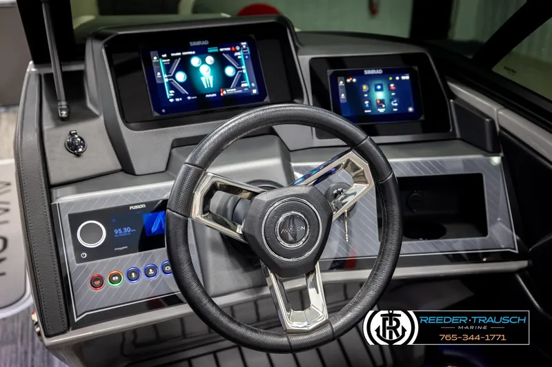 Slide: The Image of Steering wheel and dashboard of 2026 Avalon CAT CRBW boat with digital displays. - 33