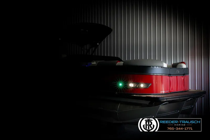 Slide: The Image of 2026 Avalon CAT CRBW boat in dimly lit showroom, highlighting sleek design and modern features. - 4