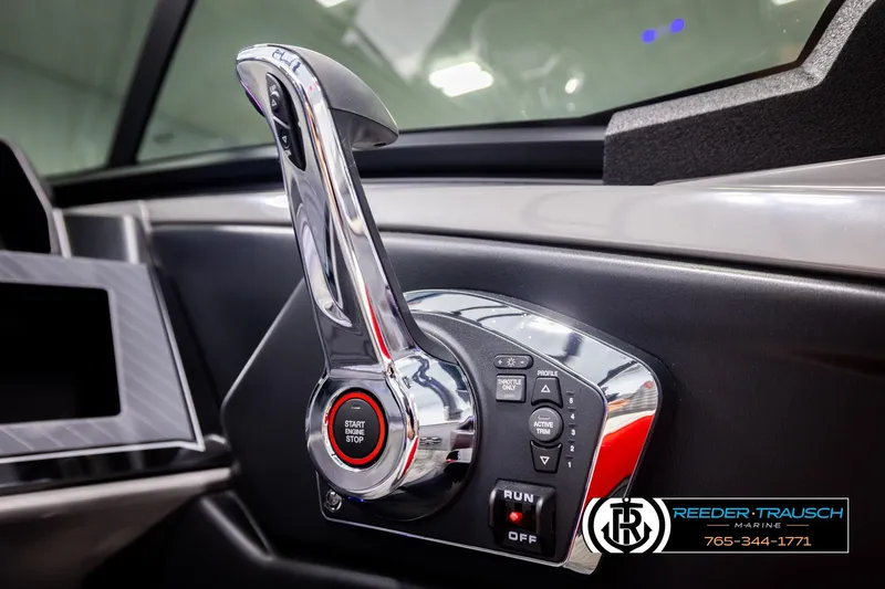 Slide: The Image of Close-up of 2026 Avalon CAT CRBW boat throttle control with start/stop button. - 41