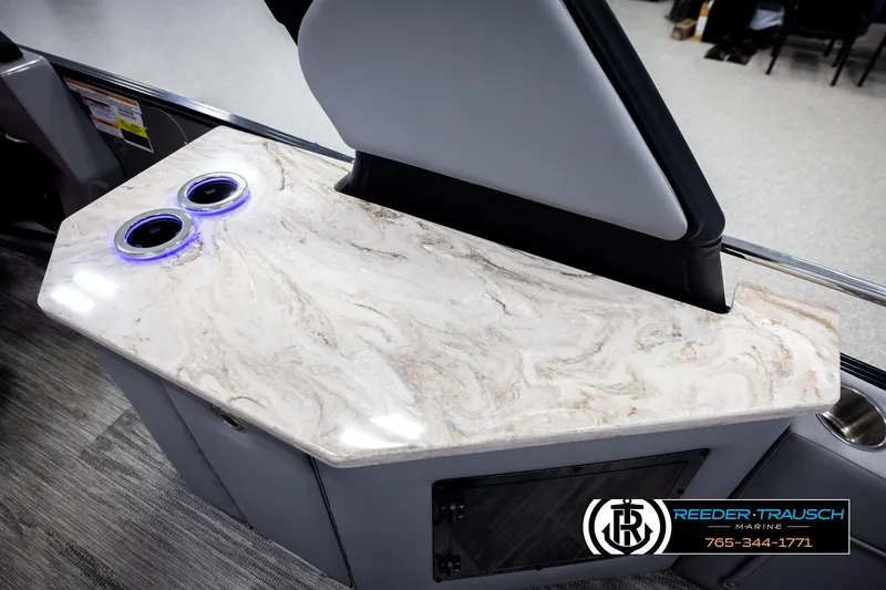 Slide: The Image of Luxurious Avalon CAT CRBW 2026 boat interior with marble countertop and illuminated cup holders. - 47