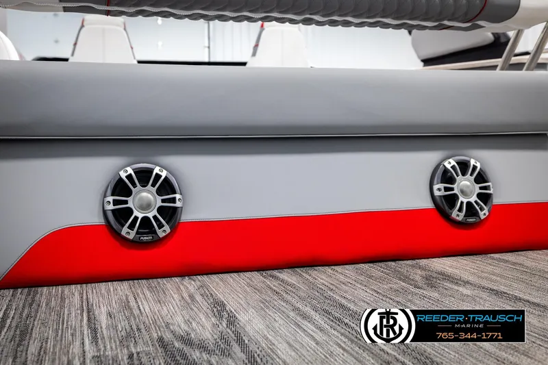 Slide: The Image of 2026 Avalon CAT CRBW boat interior with speakers, gray and red design, Reeder-Trausch Marine logo. - 50