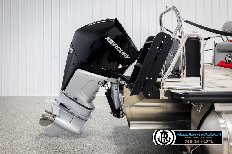 Slide: The Image of 2026 Avalon CAT CRBW boat with Mercury outboard motor, displayed in showroom. - 53