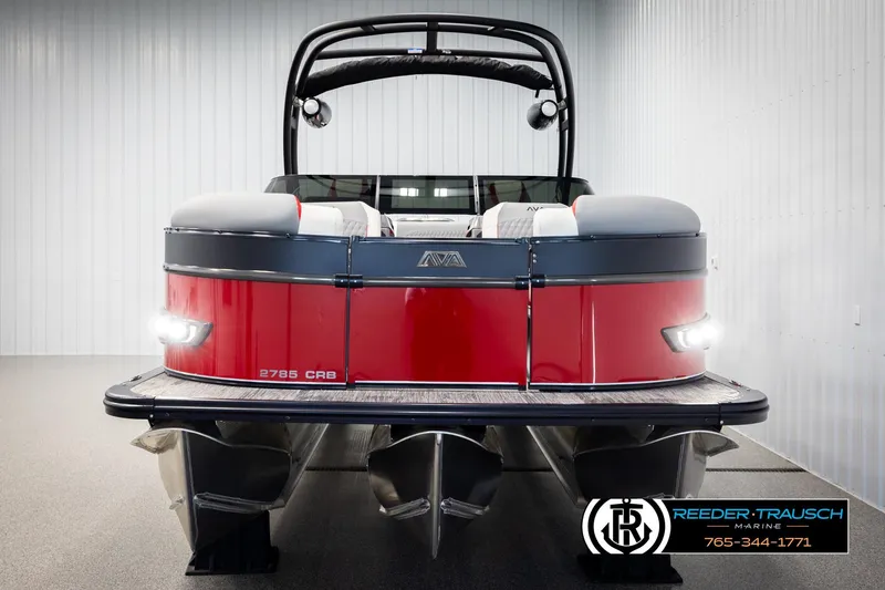 Slide: The Image of 2026 Avalon CAT CRBW pontoon boat, red exterior, displayed indoors at Reeder-Trausch Marine. - 8