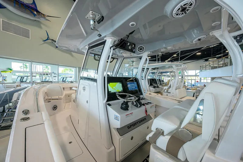 Slide: The Image of 2026 Sportsman Open 322 Center Console boat interior with modern navigation system. - 16
