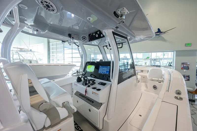 Slide: The Image of 2026 Sportsman Open 322 Center Console boat interior with advanced navigation system. - 17