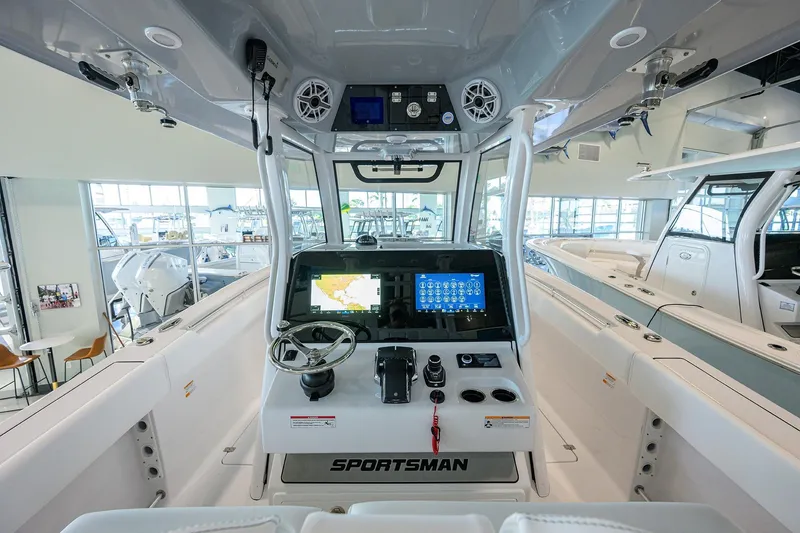 Slide: The Image of 2026 Sportsman Open 322 Center Console boat interior with advanced navigation system. - 18
