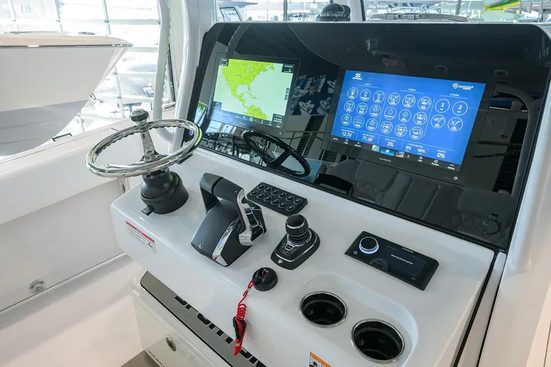 Slide: The Image of 2026 Sportsman Open 322 Center Console dashboard with advanced navigation and control systems. - 19