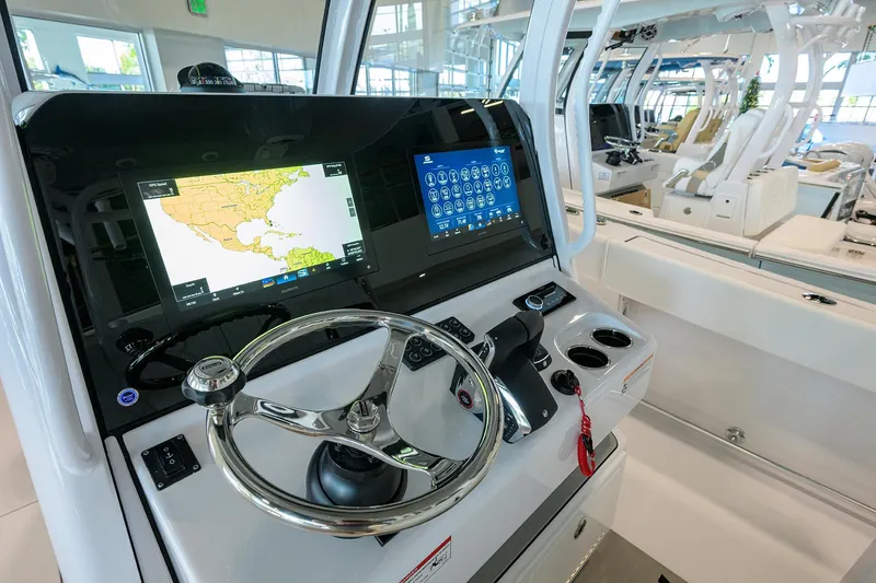 Slide: The Image of 2026 Sportsman Open 322 Center Console with advanced navigation displays and steering wheel. - 20