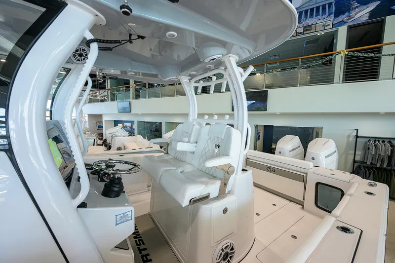 Slide: The Image of 2026 Sportsman Open 322 Center Console boat interior with modern seating and controls. - 24