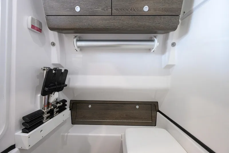 Slide: The Image of 2026 Sportsman Open 322 Center Console interior with storage and seating features. - 38