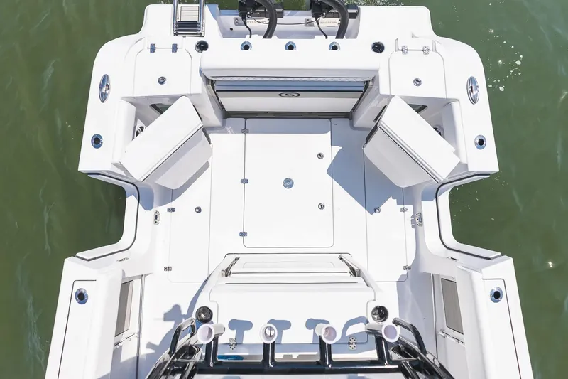 Slide: The Image of 2026 Sportsman Open 322 Center Console boat displayed in a showroom. - 4