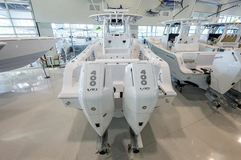 Slide: The Image of 2026 Sportsman Open 322 Center Console with twin Mercury 400 V10 engines in showroom. - 44