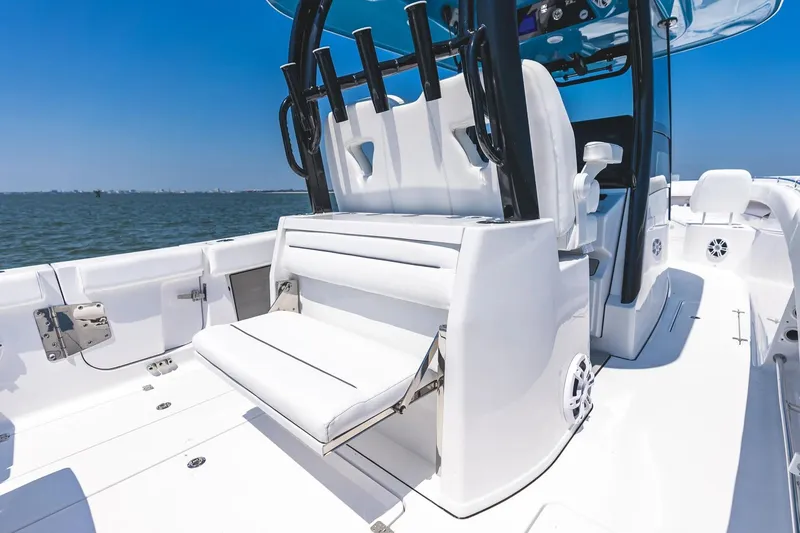 Slide: The Image of 2026 Sportsman Open 322 Center Console boat displayed in a showroom. - 5