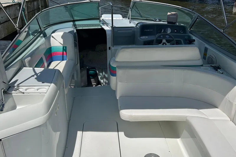 Slide: The Image of 1995 Formula 280 Sun Sport boat interior with white seating and dashboard. - 5