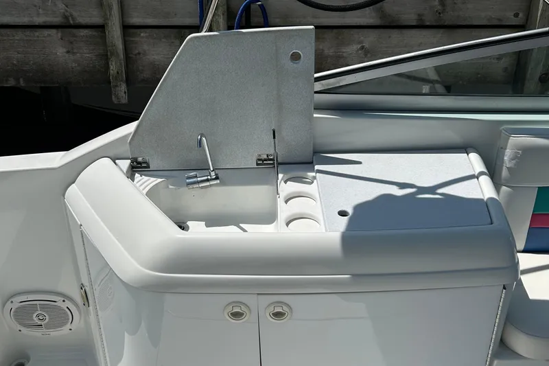 Slide: The Image of 1995 Formula 280 Sun Sport boat interior with sink and storage area. - 6