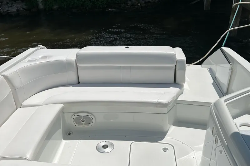 Slide: The Image of 1995 Formula 280 Sun Sport boat interior with white seating and cup holders. - 7