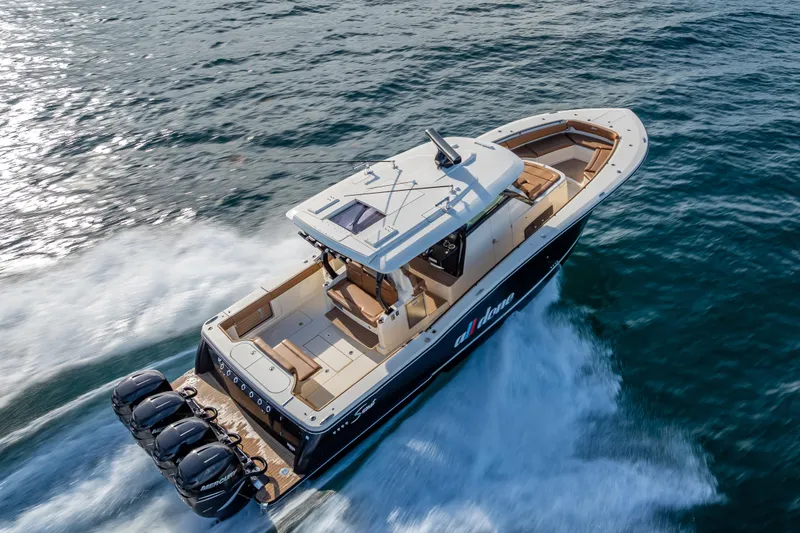Slide: The Image of 2021 Scout 380 LXF boat cruising on open water, showcasing luxury design and powerful engines. - 21