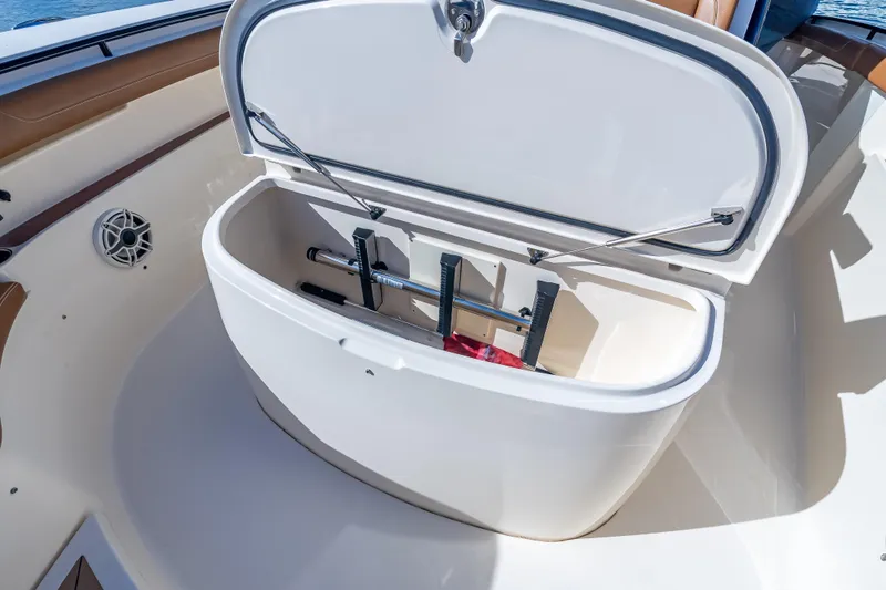 Slide: The Image of Open storage compartment on 2021 Scout 380 LXF boat, showcasing interior features. - 37