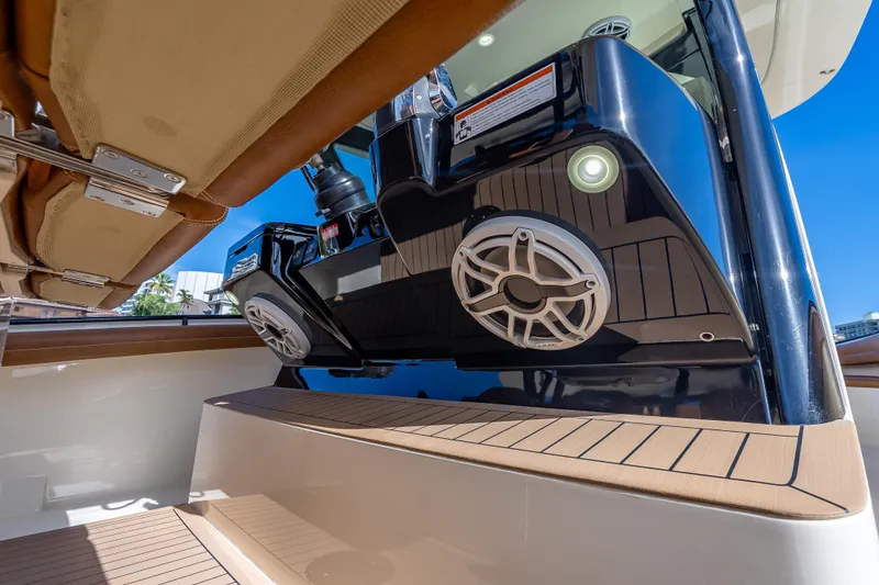 Slide: The Image of 2021 Scout 380 LXF boat with speakers and teak flooring detail. - 56