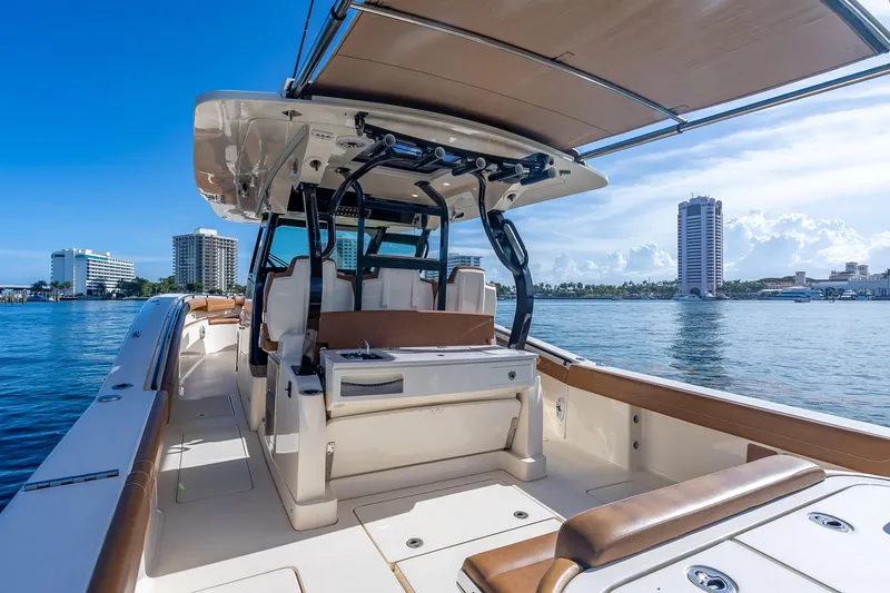 Slide: The Image of 2021 Scout 380 LXF boat interior with city skyline and waterfront view. - 66
