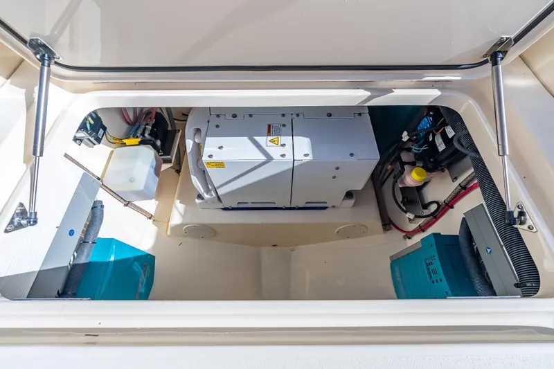 Slide: The Image of 2021 Scout 380 LXF engine compartment showcasing advanced marine equipment. - 74