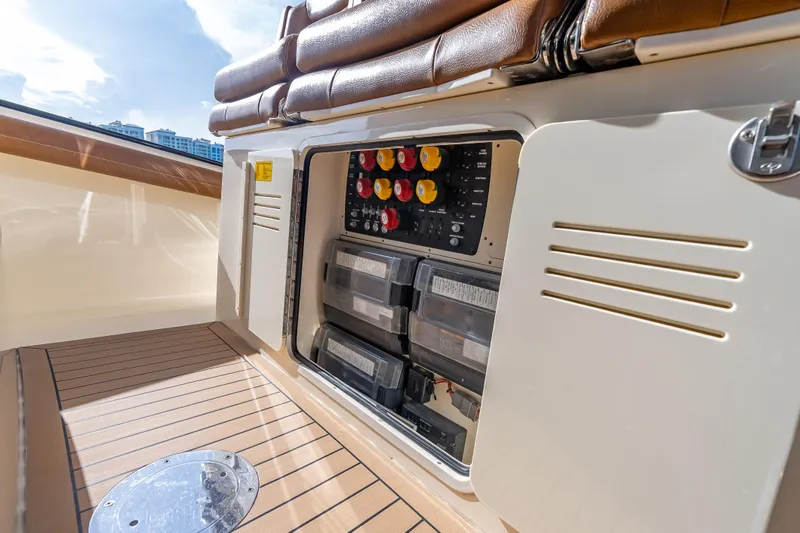 Slide: The Image of 2021 Scout 380 LXF boat electrical panel with storage compartments. - 75