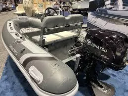 Slide: The Image of 2023 Highfield Classic 310 FCT inflatable boat with Tohatsu outboard motor on display. - 8