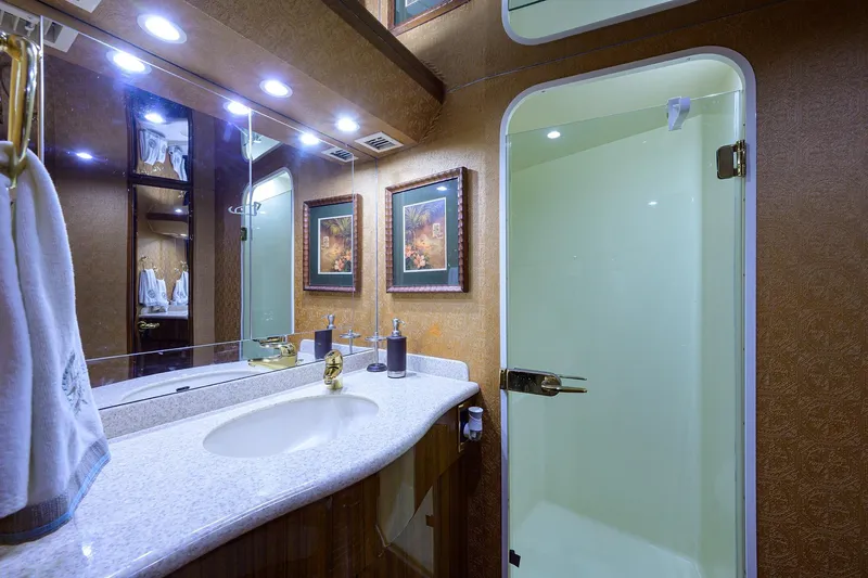 Slide: The Image of Luxurious bathroom in 2005 Viking 61 yacht with elegant fixtures and modern shower. - 15