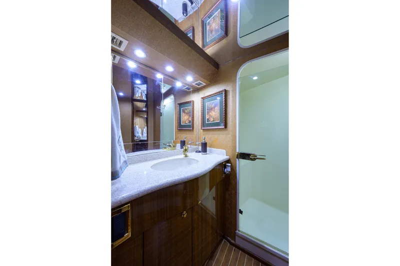 Slide: The Image of Luxurious bathroom in 2005 Viking 61 yacht with elegant fixtures and modern design. - 16