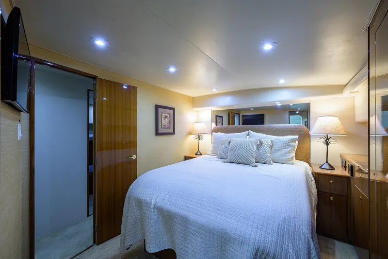 Slide: The Image of Luxurious bedroom interior of 2005 Viking 61 yacht with elegant lighting and decor. - 18