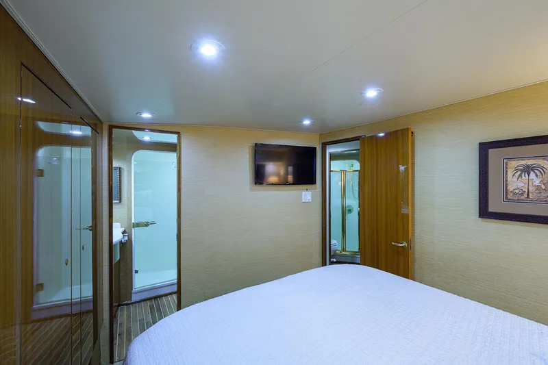 Slide: The Image of Luxurious cabin interior of a 2005 Viking 61 yacht with modern amenities. - 19