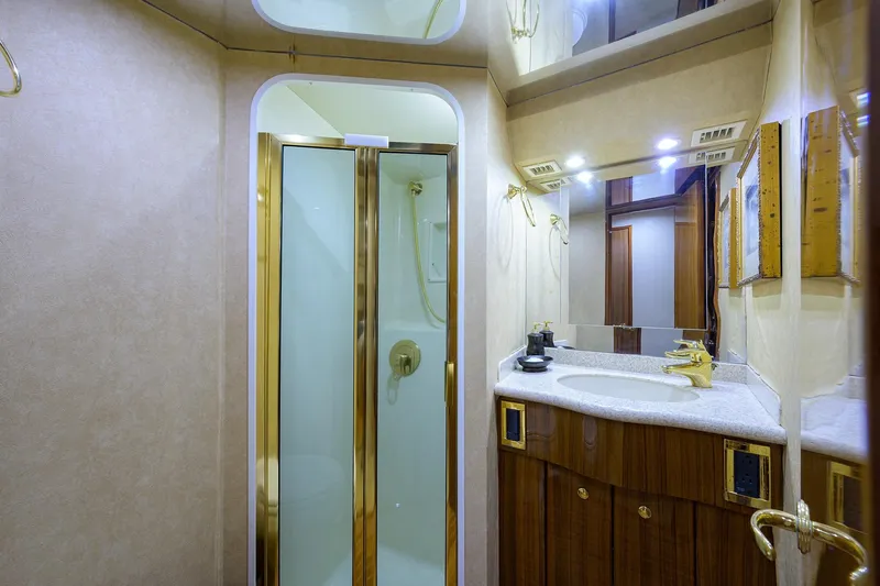 Slide: The Image of Luxurious bathroom in 2005 Viking 61 yacht with shower and elegant vanity. - 24