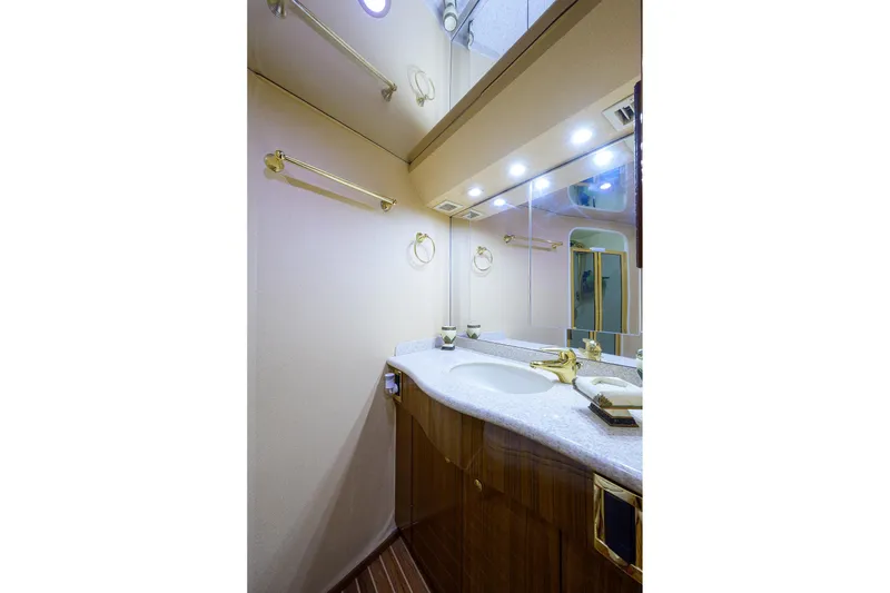 Slide: The Image of Luxurious bathroom in 2005 Viking 61 yacht with elegant fixtures and ample lighting. - 32