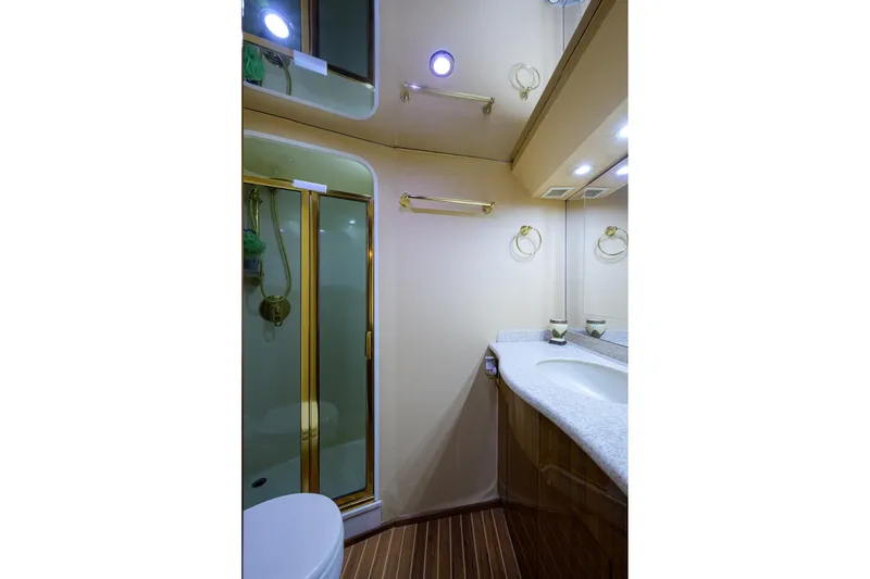 Slide: The Image of Luxurious bathroom in 2005 Viking 61 yacht with shower and elegant fixtures. - 33