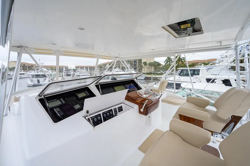 Slide: The Image of Luxurious 2005 Viking 61 yacht helm with modern controls and comfortable seating. - 42