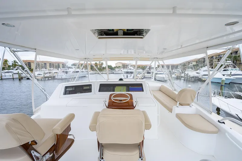 Slide: The Image of Luxurious 2005 Viking 61 yacht helm with modern navigation system and comfortable seating. - 48