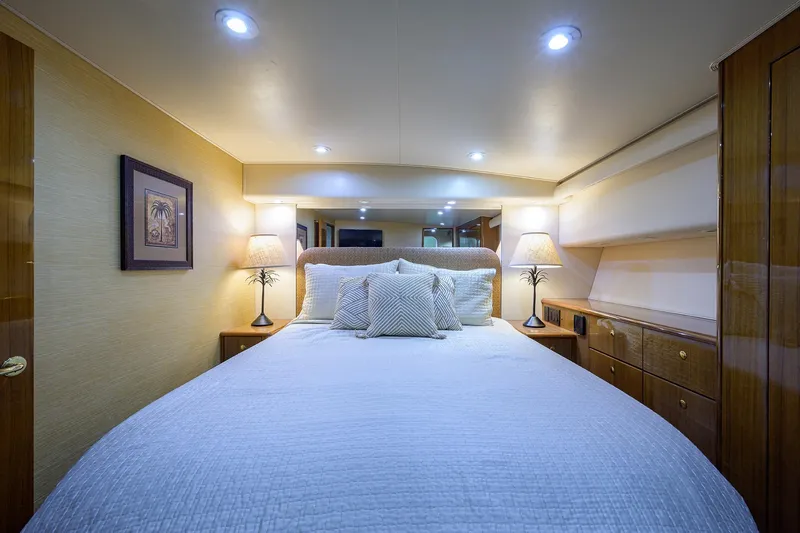 Slide: The Image of Luxurious bedroom interior of 2005 Viking 61 yacht with elegant lighting and decor. - 52