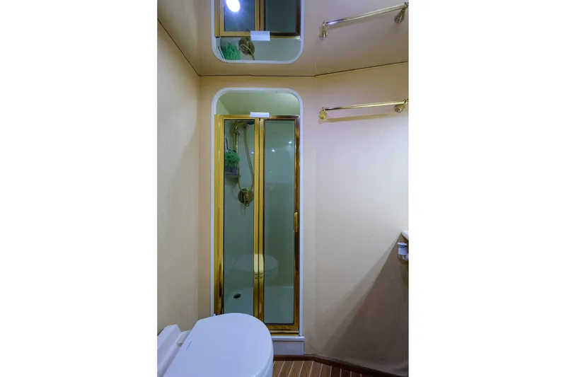 Slide: The Image of Luxurious bathroom in 2005 Viking 61 yacht with glass shower and elegant fixtures. - 53