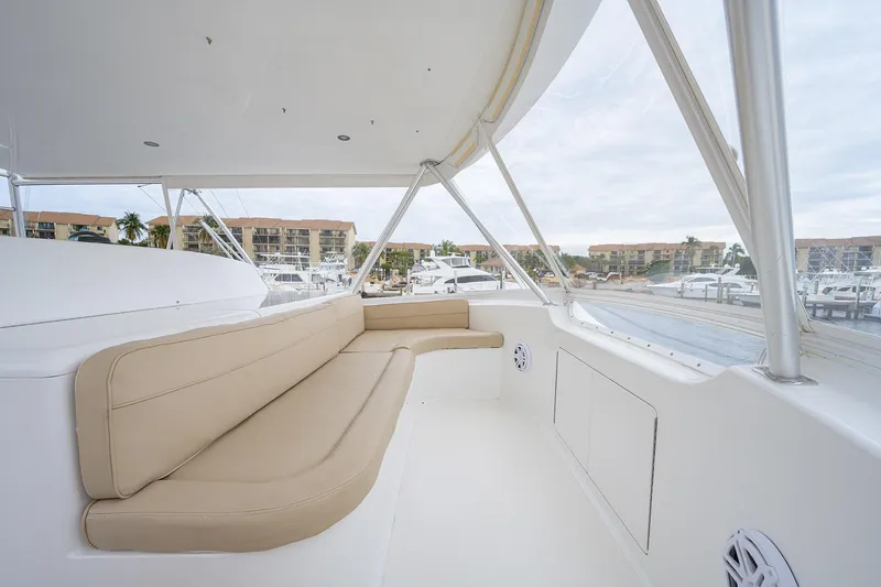 Slide: The Image of Spacious seating area on 2005 Viking 61 yacht, overlooking marina with modern amenities. - 55