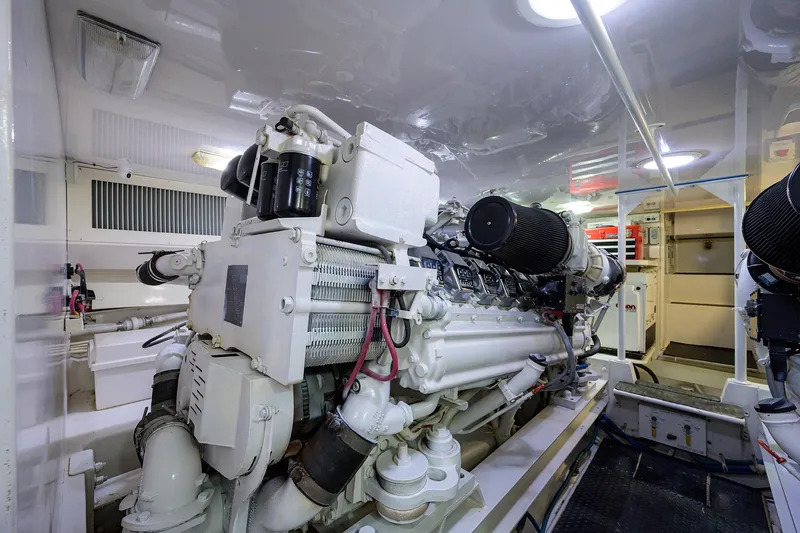Slide: The Image of Engine room of a 2005 Viking 61 yacht, showcasing a powerful marine engine. - 64
