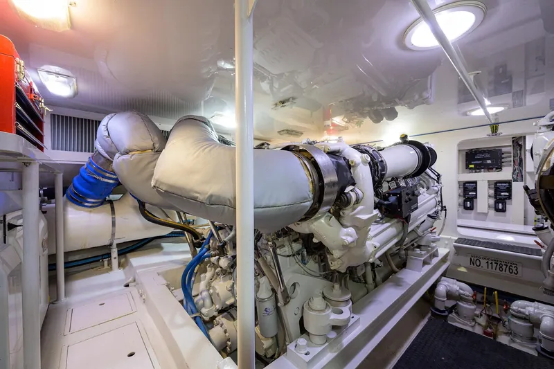 Slide: The Image of Engine room of a 2005 Viking 61 yacht, showcasing powerful machinery and equipment. - 66