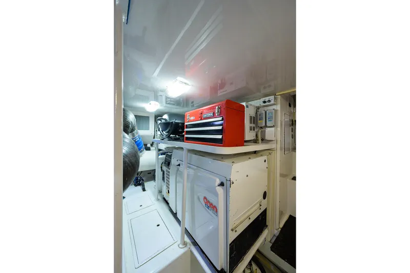 Slide: The Image of Engine room of 2005 Viking 61 yacht with tool chest and equipment. - 67