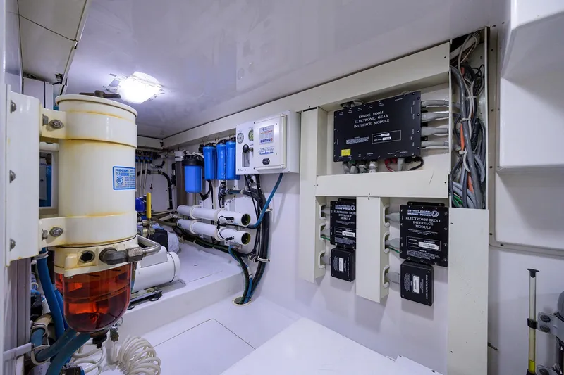 Slide: The Image of Engine room of 2005 Viking 61 yacht with electronic gear and filtration systems. - 70