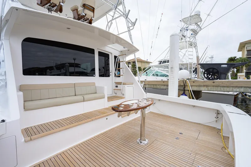 Slide: The Image of 2005 Viking 61 yacht deck with seating and fishing rod holders. - 81