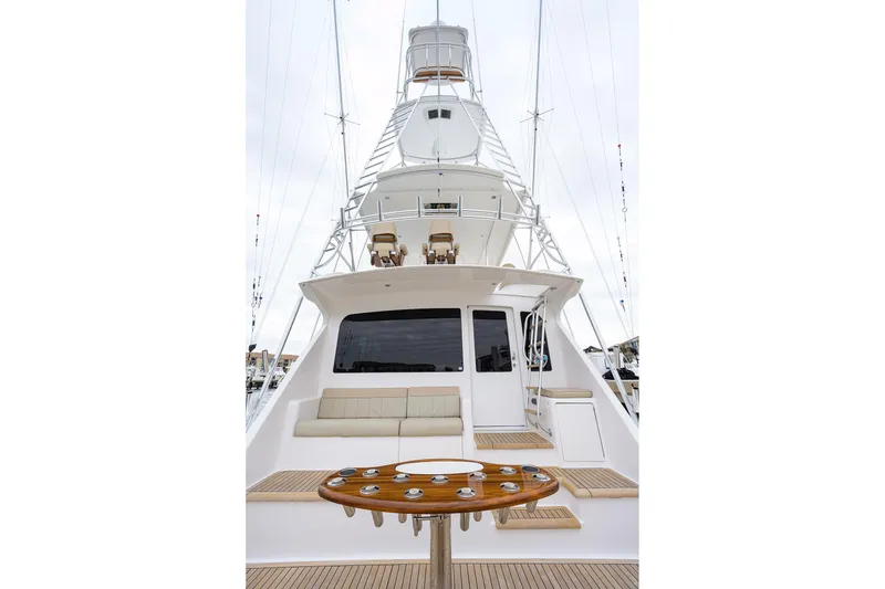 Slide: The Image of 2005 Viking 61 yacht with spacious deck and seating area. - 82