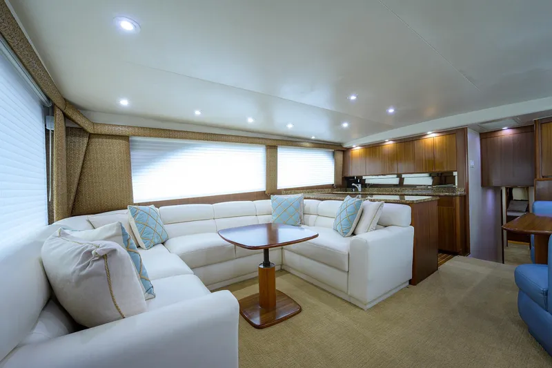 Slide: The Image of Luxurious interior of a 2005 Viking 61 yacht with elegant seating and modern decor. - 96