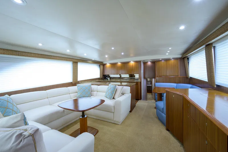 Slide: The Image of Luxurious interior of 2005 Viking 61 yacht with elegant seating and wooden cabinetry. - 97