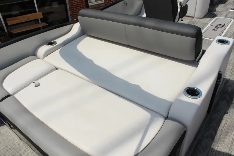 Slide: The Image of 2023 Tahoe Pontoon Cascade Platinum Versatile Rear Bench, featuring luxurious seating and cup holders. - 10